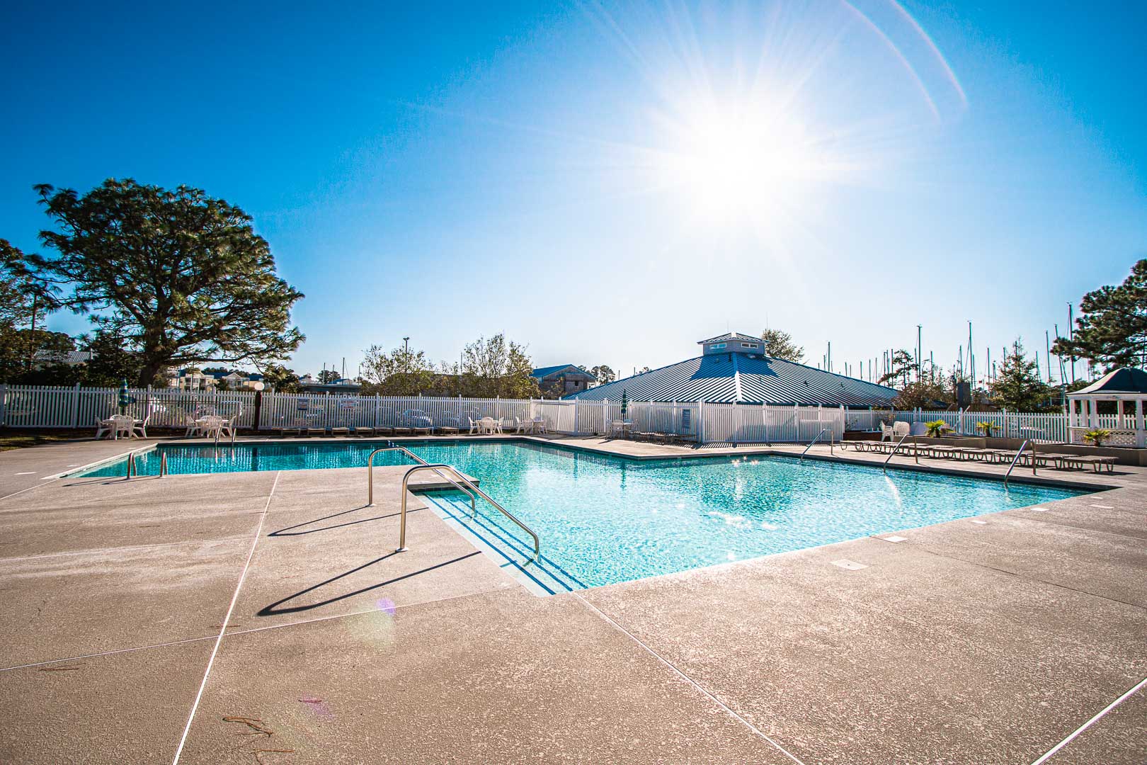 A crisp outdoor swimming pool at VRI's Waterwood Townhomes in New Bern, North Carolina.